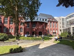 A pathway leading to an old university building